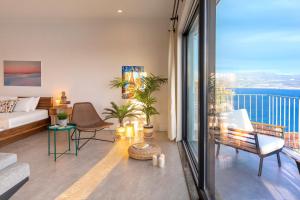 a living room with a view of the ocean at Born in Blue in Kaş