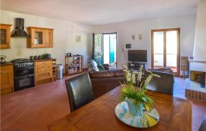 a living room with a table and a couch at Beautiful Apartment In Bucine With Outdoor Swimming Pool in Bucine