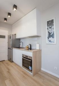 Kuchyňa alebo kuchynka v ubytovaní Urban Jungle - Grey Apartment