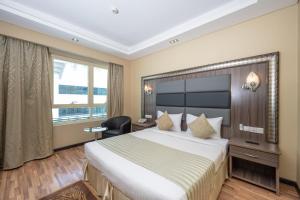 Postel nebo postele na pokoji v ubytování Pearl Swiss Hotel + 37 fotografií