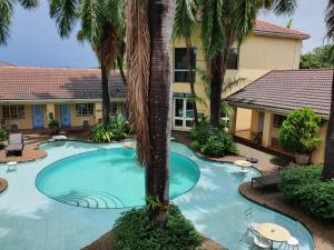an image of a swimming pool at a resort at At SILVER PALMS in Tzaneen