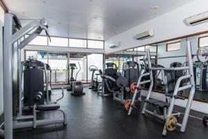 a gym with rows of treadmills and machines at Hotel Slipway in Dar es Salaam