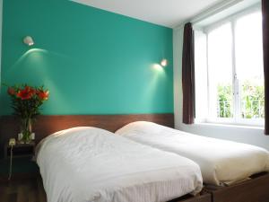 Postel nebo postele na pokoji v ubytování Au Bon Gîte