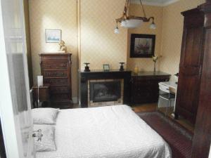 Posteľ alebo postele v izbe v ubytovaní Bruneval House
