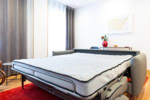 Posteľ alebo postele v izbe v ubytovaní Unamuno by Bilbao Living