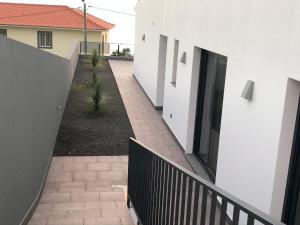 an external view of a house with a walkway at Calheta Ocean View Apartment 2 in Estreito da Calheta