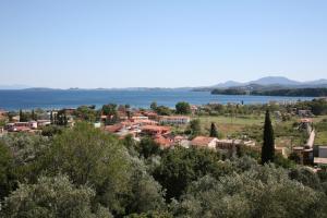 a small town with a lake in the background at Corfu Secret Hotel in Ýpsos