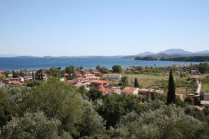 a small town with a lake in the background at Corfu Secret Hotel in Ipsos