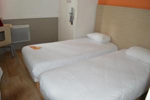 Postel nebo postele na pokoji v ubytování Première Classe Toulouse Nord - L'Union