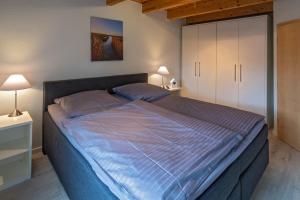 Un pat sau paturi într-o cameră la Friedas Huus