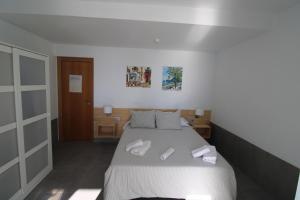 Ein Bett oder Betten in einem Zimmer der Unterkunft Hostal Fornet Altea