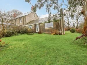 a house with a lawn in front of it at Orchard End in Boyton