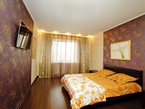 Säng eller sängar i ett rum på Apartments SarKvartira na Vavilova