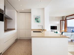 a kitchen with white cabinets and a counter top at Apartment Cofisa-2 by Interhome in Jávea