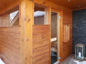 a wooden door in a cabin with a window at Holiday Home Nikola by Interhome in Flachau