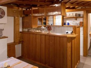 a kitchen with a wooden bar in a restaurant at Chalet Alpinchalet Zigjam - GUR600 by Interhome in Gaschurn