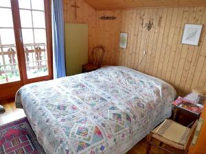 Cama o camas de una habitación en Chalet Gillioz by Interhome