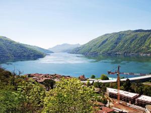 a view of a river with a town and a city at Holiday Home Christa by Interhome in Bissone