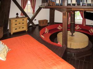 a living room with a large room with a wooden floor at Holiday Home Sielmühle by Interhome in Middelsbur