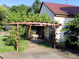 a pergola in the garden of a house at Apartment Am Burgberg by Interhome in Eilenburg
