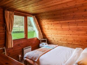 Ένα ή περισσότερα κρεβάτια σε δωμάτιο στο Rose Lodge