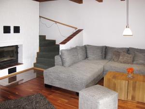 a living room with a couch and a fireplace at Holiday Home Johanna by Interhome in Hooksiel
