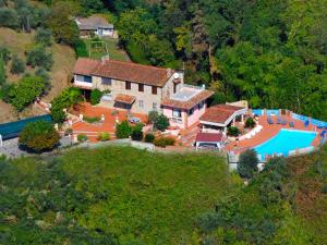 an aerial view of a house with a swimming pool at Villa La Chiazza by Interhome in Corsanico-Bargecchia