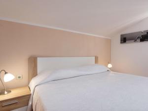Postel nebo postele na pokoji v ubytování Holiday Home Anea by Interhome