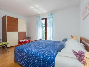 Postel nebo postele na pokoji v ubytování Apartment Nena-1 by Interhome