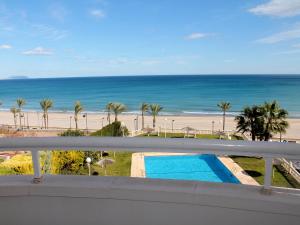 a view of the beach from the balcony of a condo at Apartment Urbaeuropa by Interhome in La Venteta