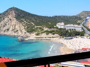 a view of a beach with a bunch of people at Apartment Cala Blanca by Interhome in Cala de Finestrat