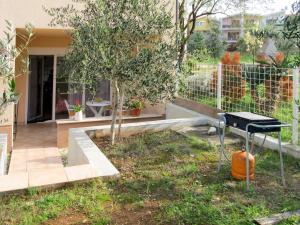 a barbecue grill in the yard of a house at Apartment Vivoda - PUL168 by Interhome in Štinjan