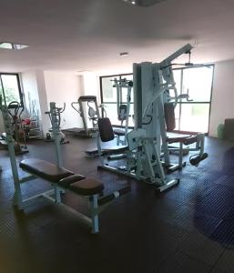 a gym with several tread machines in a room at Residencial Amazonia Apto 1205 in João Pessoa