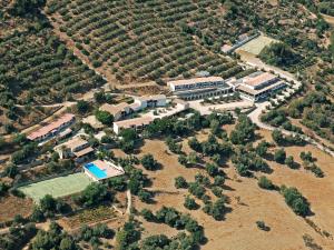 an aerial view of a house with a tennis court at Apartment Is Murtas-5 by Interhome in Cardedu