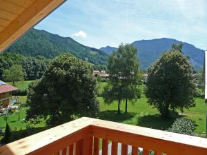 a balcony with a view of a field and trees at Apartment Bibelöd-5 by Interhome in Ruhpolding