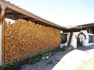 a wall of fire wood on the side of a building at Apartment Lener-1 by Interhome in Matrei am Brenner +10 photos