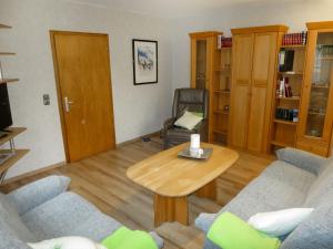 a living room with a table and two chairs at Holiday Home Haus Irmgard by Interhome in Haserich +18 photos