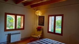 En eller flere senge i et værelse på Lujosa casa mallorquina restaurada "Es carrero"