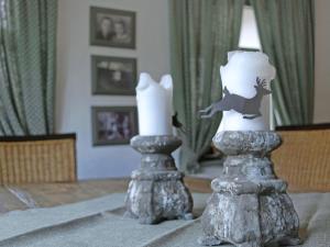 two candles sitting on top of a table at Apartment Hiddensee by Interhome in Dargun +18 photos