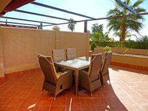 a table and chairs sitting on a patio at Apartment Mirador de la Yesera by Interhome in Santa Fe de los Boliches