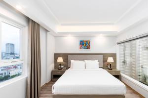 Postel nebo postele na pokoji v ubytování Golden Rose Hotel