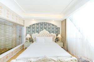 Postel nebo postele na pokoji v ubytování Golden Rose Hotel