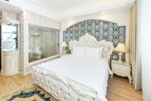 Postel nebo postele na pokoji v ubytování Golden Rose Hotel