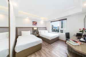 Postel nebo postele na pokoji v ubytování Golden Rose Hotel