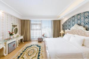 Postel nebo postele na pokoji v ubytování Golden Rose Hotel