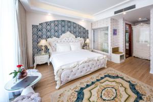 Postel nebo postele na pokoji v ubytování Golden Rose Hotel