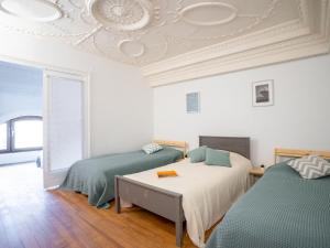 a bedroom with two beds and a ceiling at Apartment Reine Victoria by Interhome in Biarritz