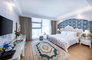 Postel nebo postele na pokoji v ubytování Golden Rose Hotel