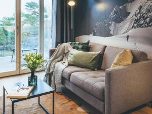 a living room with a couch and a table at Apartment Mariandl am Meer-1 by Interhome in Binz