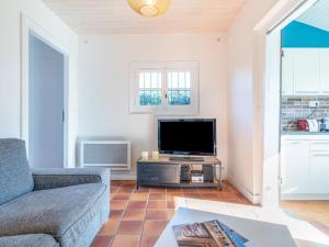 TV a/nebo společenská místnost v ubytování Holiday Home Poste by Interhome